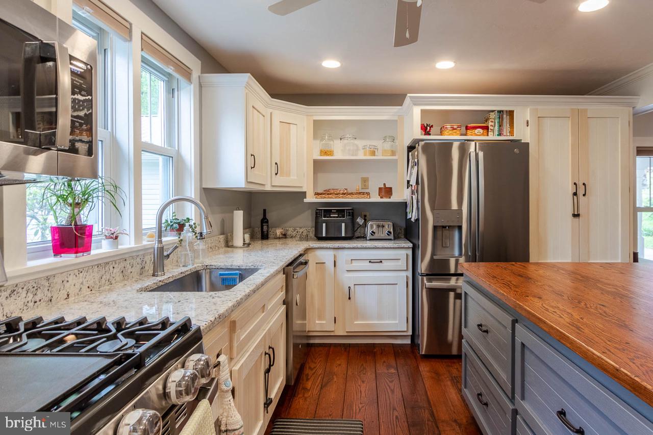 1834 Decker Hollow Road Tyrone, PA 16686 - Photo 18 of 40 a kitchen with stainless steel appliances granite countertop a sink stove and refrigerator