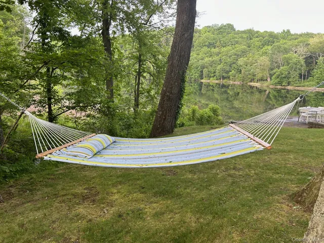 an outdoor sitting area with furniture and city view