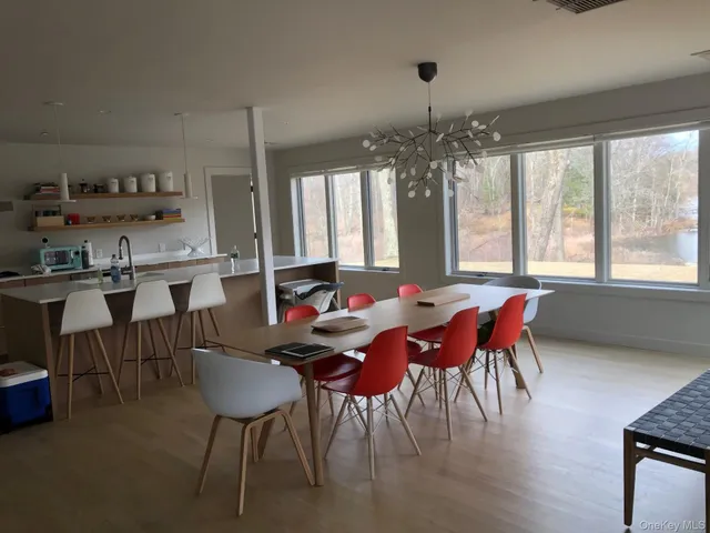 a view of a dining room with furniture window and outside view
