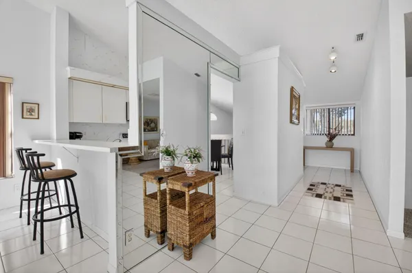 a kitchen with stainless steel appliances a stove a sink and a microwave