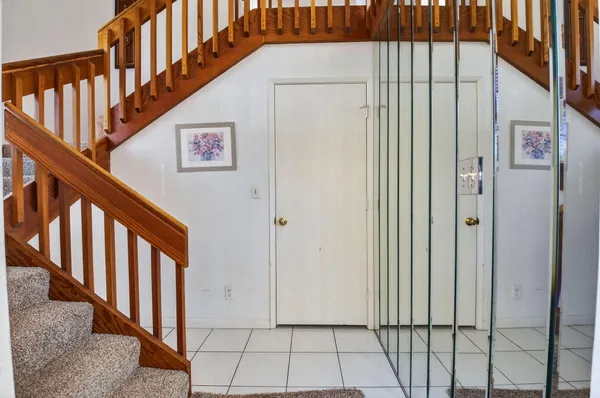 a view of an entryway with wooden floor