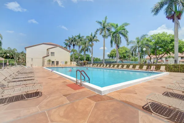 a view of swimming pool with furniture
