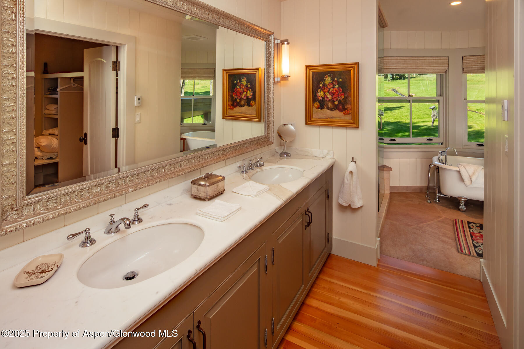 2147 Lower River Road Snowmass, CO 81654 - Photo 17 of 61 a spacious bathroom with double vanity sink a mirror and a bathtub