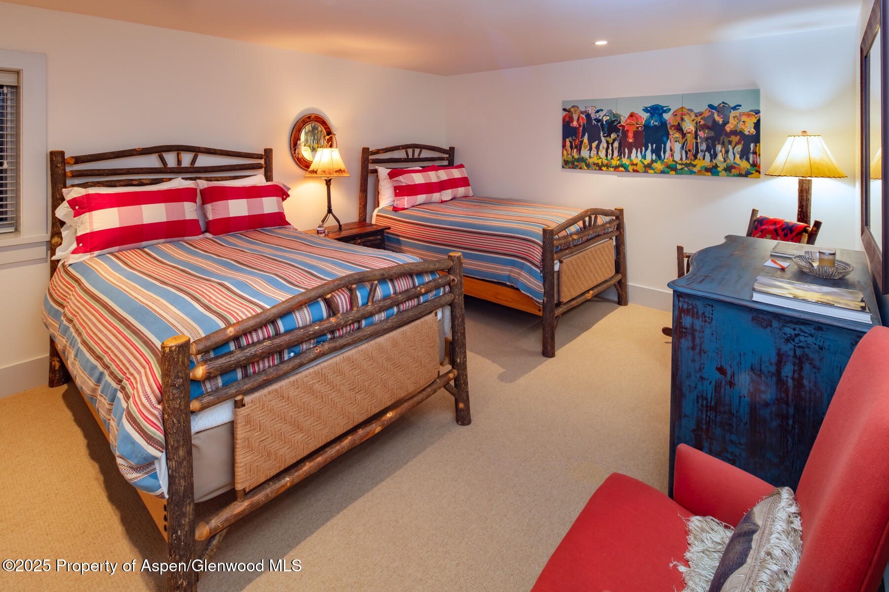 2147 Lower River Road Snowmass, CO 81654 - Photo 18 of 61 a bedroom with a bed and wooden floor