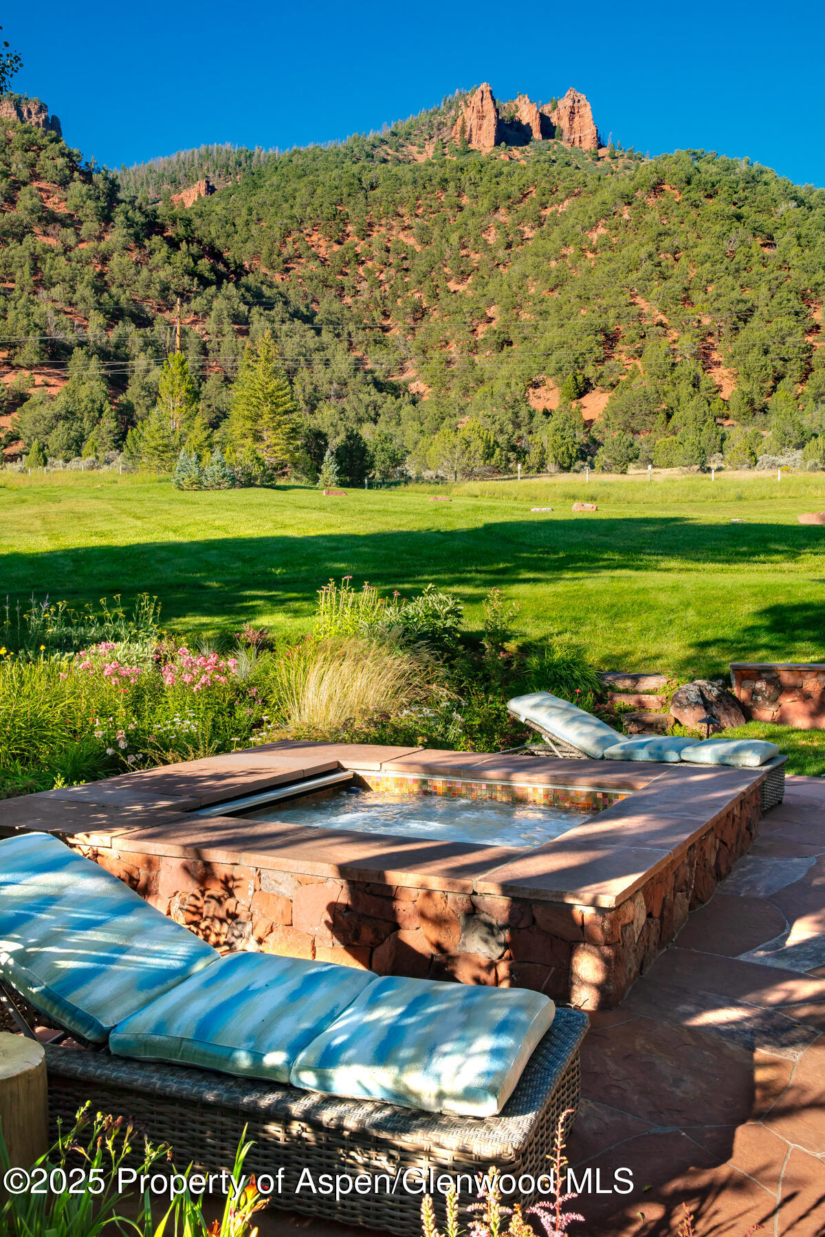 2147 Lower River Road Snowmass, CO 81654 - Photo 21 of 61 a view of a lake with a big yard
