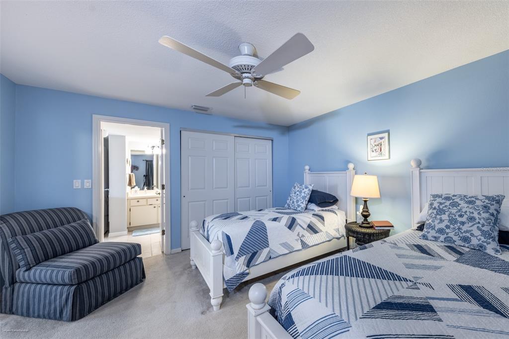 1477 Park Beach Circle, Unit 11 Punta Gorda, FL 33950 - Photo 12 of 49 a bedroom with a bed couch and window