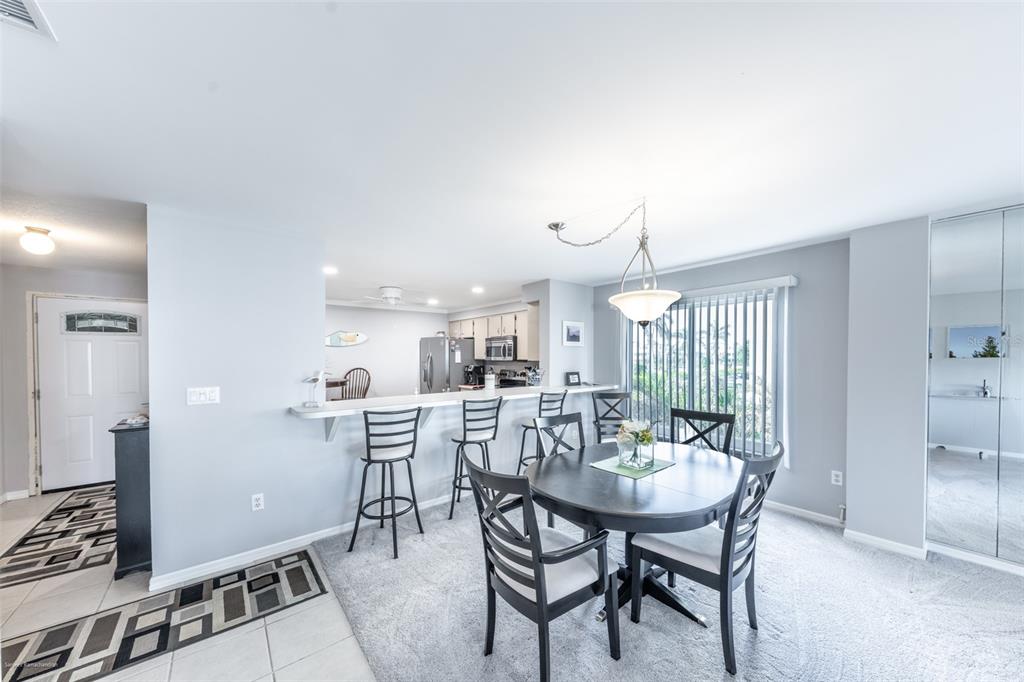 1477 Park Beach Circle, Unit 11 Punta Gorda, FL 33950 - Photo 18 of 49 a view of a dining room with furniture
