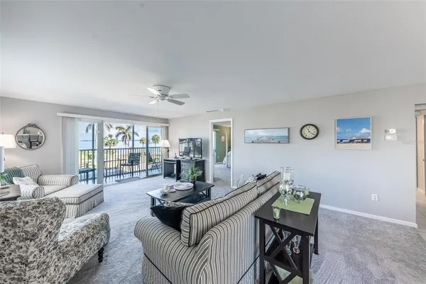 a living room with furniture and a table