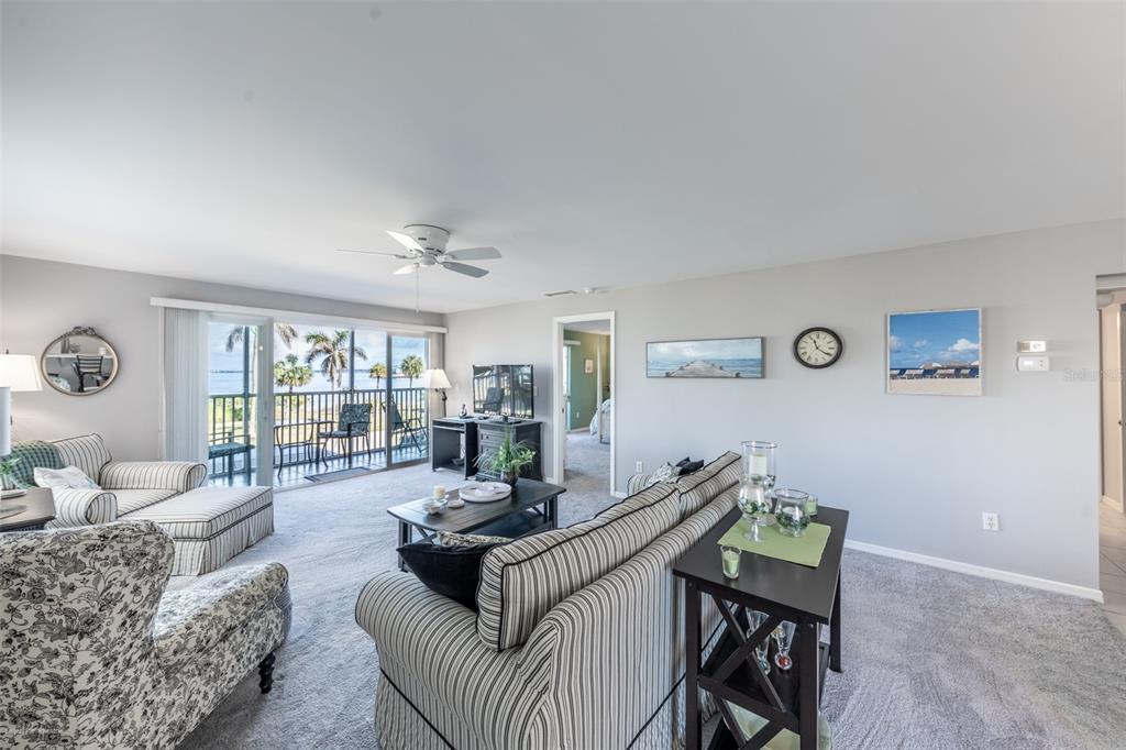 1477 Park Beach Circle, Unit 11 Punta Gorda, FL 33950 - Photo 20 of 49 a living room with furniture and a table