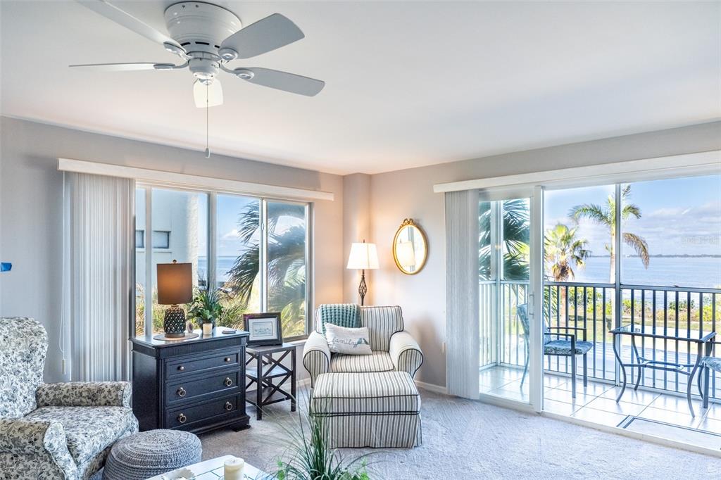 1477 Park Beach Circle, Unit 11 Punta Gorda, FL 33950 - Photo 23 of 49 a living room with furniture and a large window