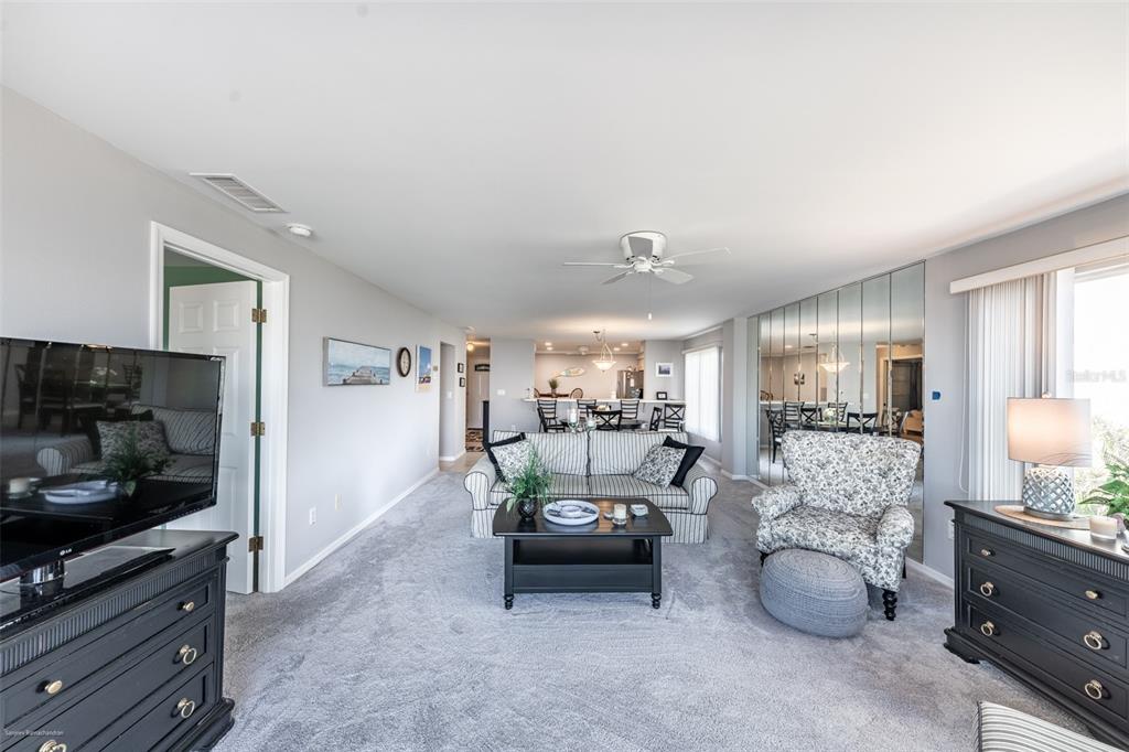 1477 Park Beach Circle, Unit 11 Punta Gorda, FL 33950 - Photo 26 of 49 a living room with furniture and a flat screen tv