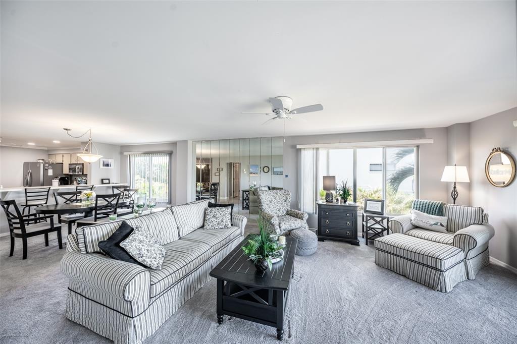 1477 Park Beach Circle, Unit 11 Punta Gorda, FL 33950 - Photo 28 of 49 a living room with furniture and a large window