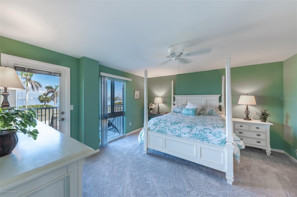 1477 Park Beach Circle, Unit 11 Punta Gorda, FL 33950 - Photo 30 of 49 a bedroom with a large bed and a potted plant