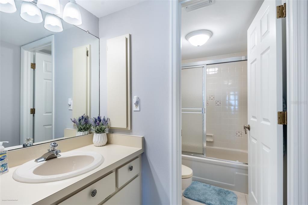 1477 Park Beach Circle, Unit 11 Punta Gorda, FL 33950 - Photo 39 of 49 a bathroom with a sink toilet tub and shower