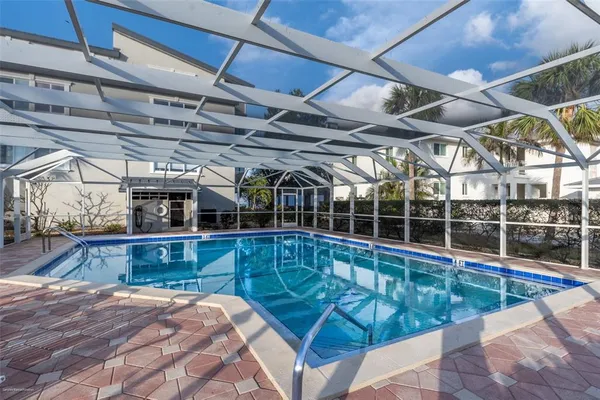 a view of a swimming pool with a patio