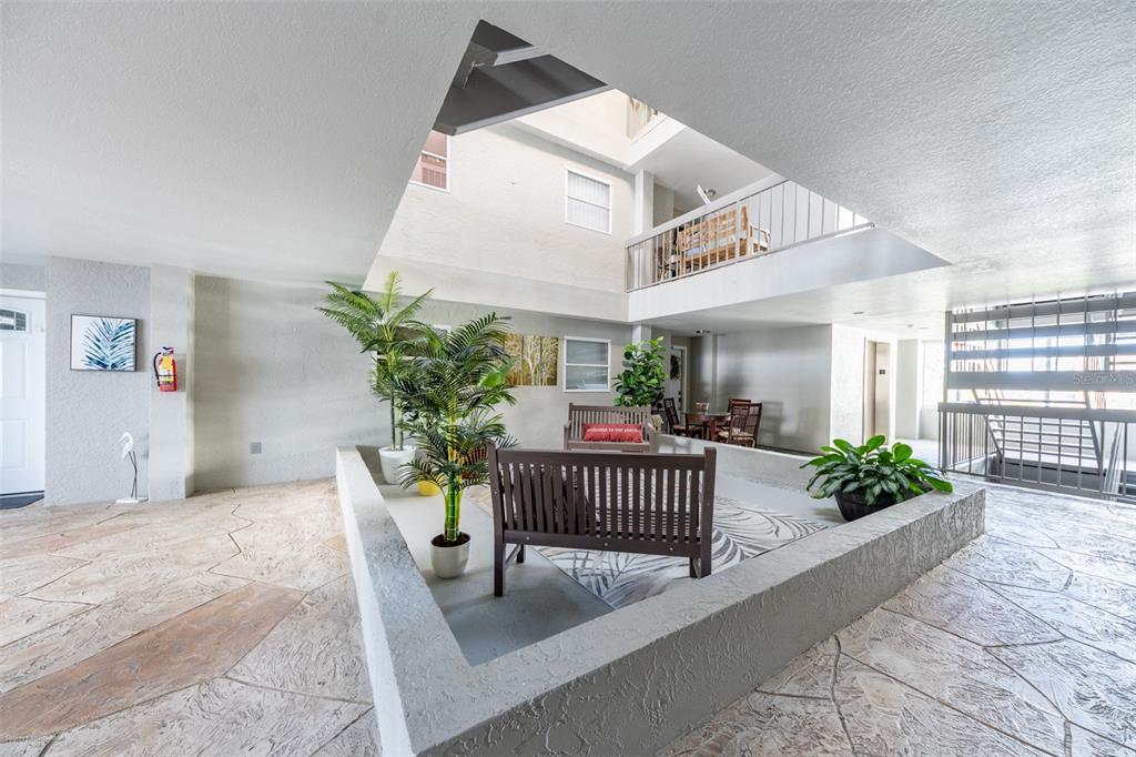 1477 Park Beach Circle, Unit 11 Punta Gorda, FL 33950 - Photo 43 of 49 a view of a porch with furniture and garden