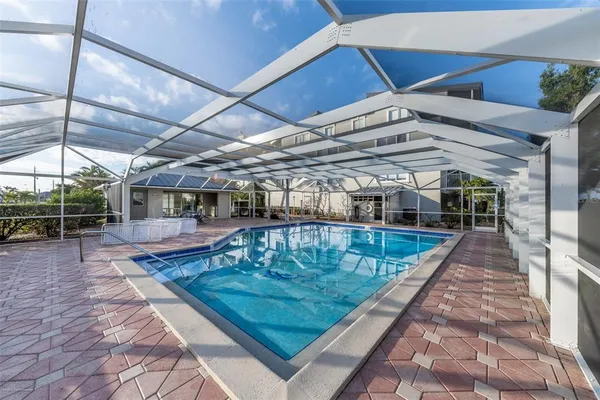 a view of a swimming pool with a patio