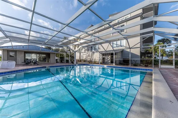 a view of a swimming pool with a patio