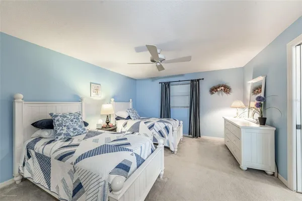 a bedroom with a bed and a couch