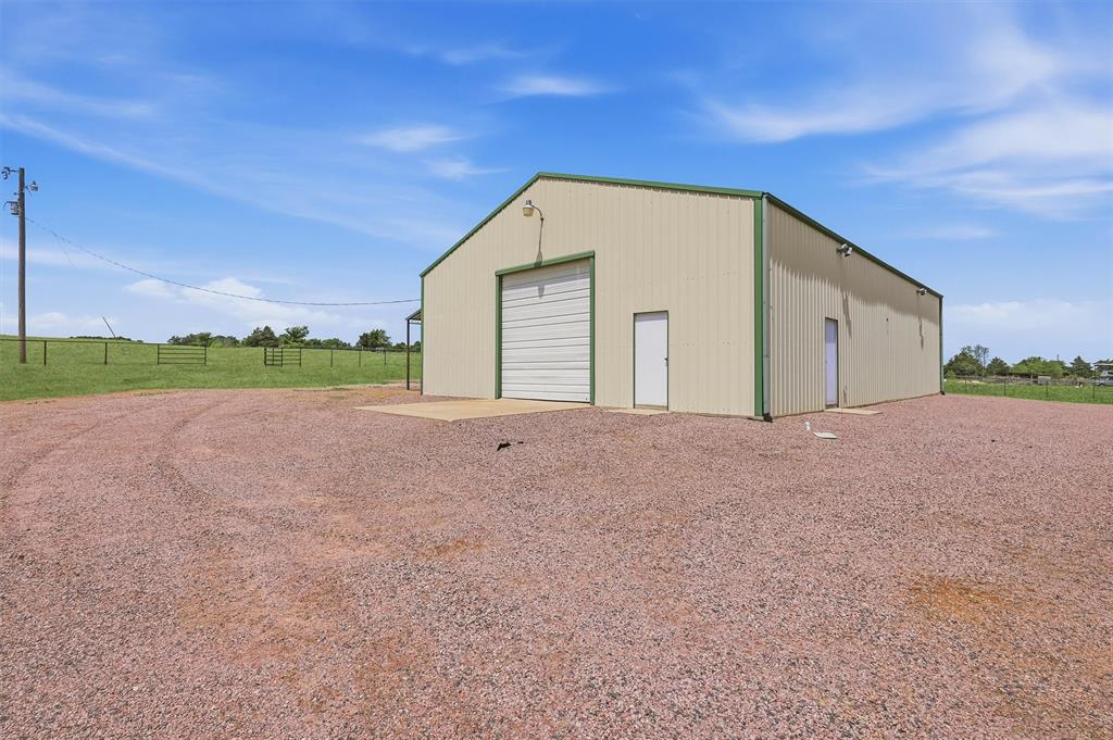 1861-1 Roland Road Whitesboro, TX 76273 - Photo 28 of 39 Shop at the rear of the property has a large parking pad.