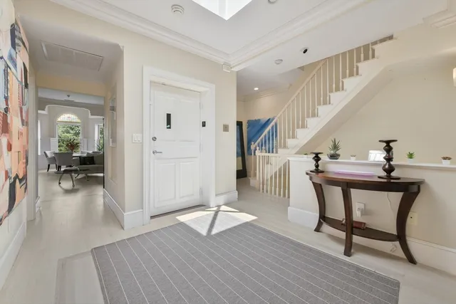 a view of a livingroom with wooden floor and furniture