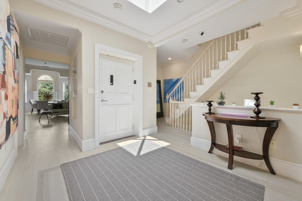 294 Commonwealth Avenue, Unit 2 Boston, MA 02115 - Photo 13 of 26 a view of a livingroom with wooden floor and furniture
