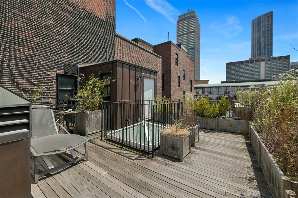 294 Commonwealth Avenue, Unit 2 Boston, MA 02115 - Photo 14 of 26 a view of a deck with furniture and wooden floor