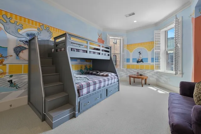 a bedroom with a bed and a table in it