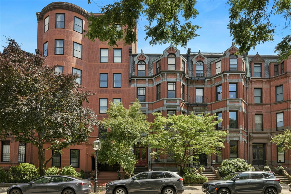 294 Commonwealth Avenue, Unit 2 Boston, MA 02115 - Photo 26 of 26 a couple of cars parked in front of brick building