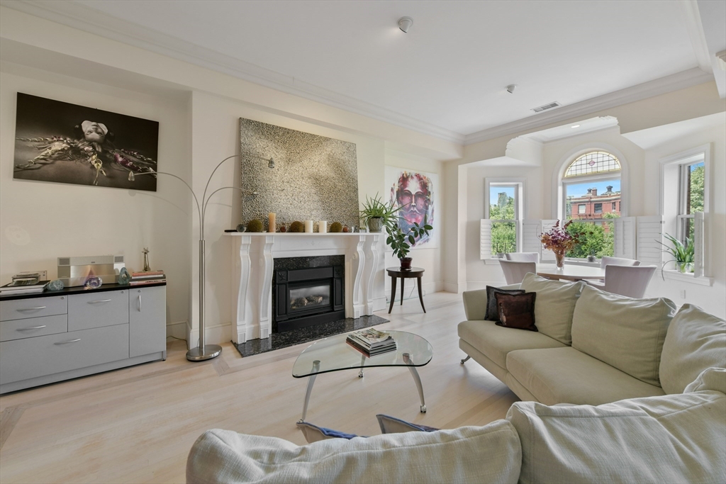 294 Commonwealth Avenue, Unit 2 Boston, MA 02115 - Photo 4 of 26 a living room with furniture and a fireplace