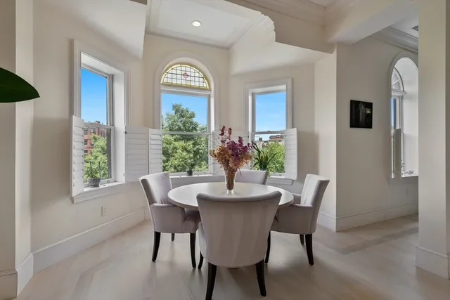 a dining room with furniture and window