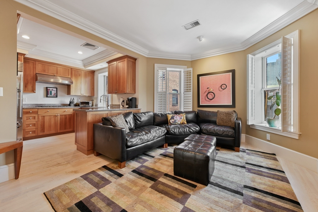294 Commonwealth Avenue, Unit 2 Boston, MA 02115 - Photo 8 of 26 a living room with furniture and a window