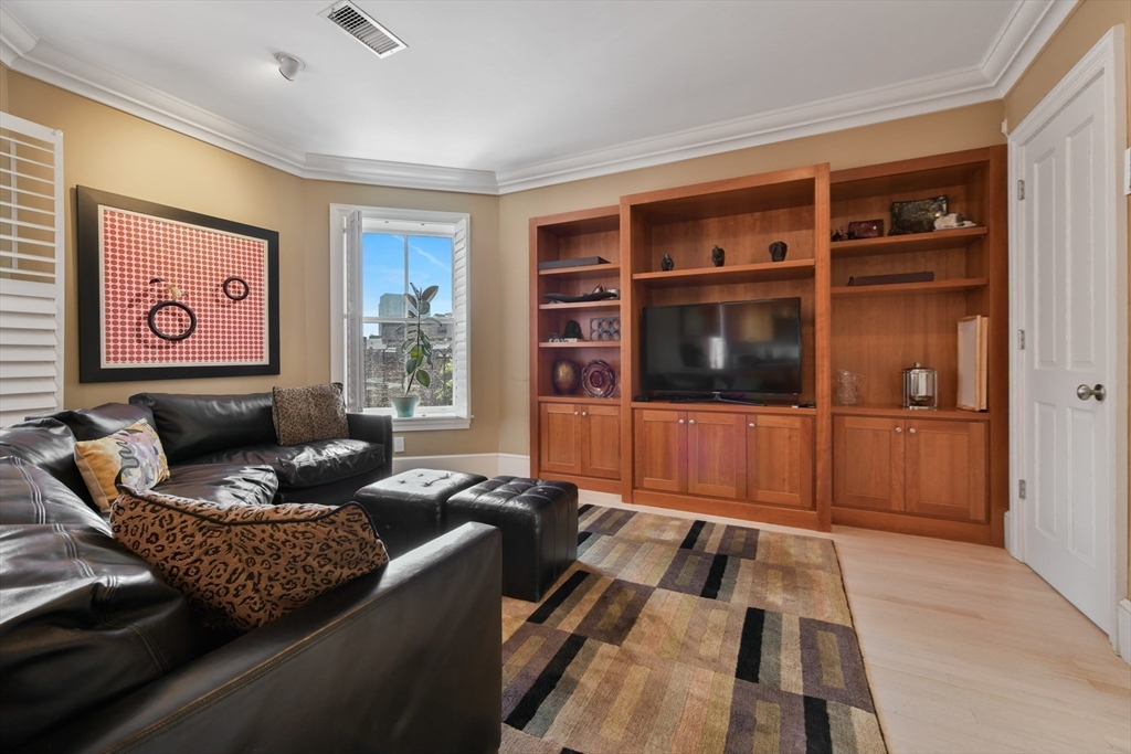 294 Commonwealth Avenue, Unit 2 Boston, MA 02115 - Photo 9 of 26 a living room with furniture and a flat screen tv