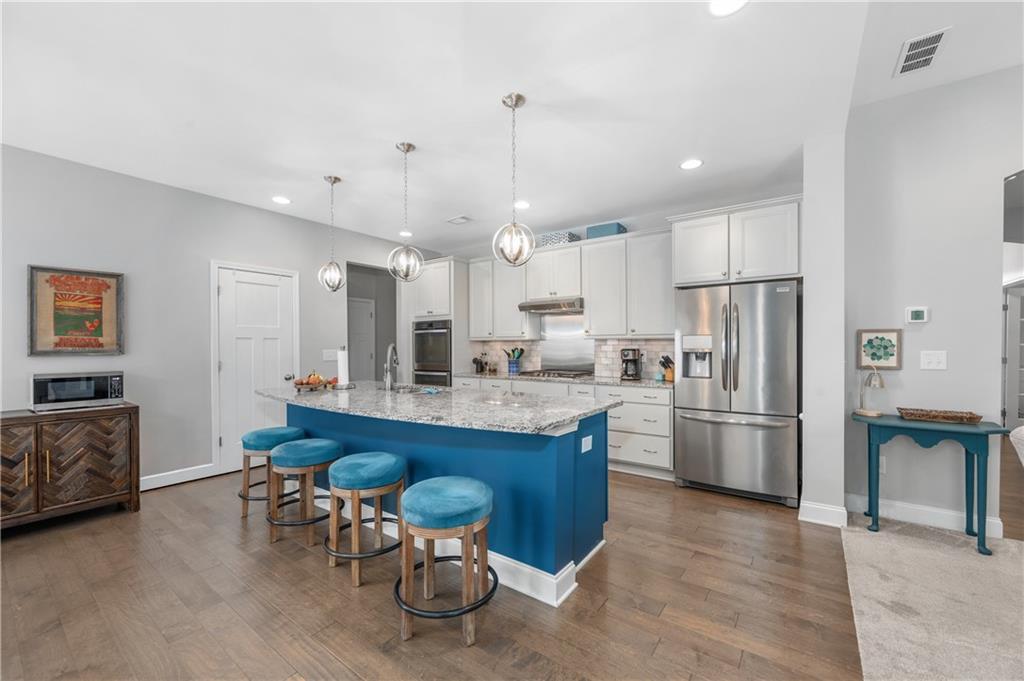 39 Floating Leaf Way Dallas, GA 30132 - Photo 13 of 40 a large kitchen with a table and chairs