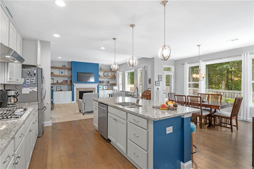 39 Floating Leaf Way Dallas, GA 30132 - Photo 15 of 40 a large kitchen with stainless steel appliances kitchen island granite countertop a large island in the center