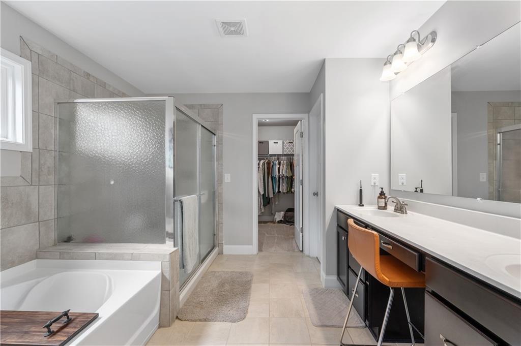 39 Floating Leaf Way Dallas, GA 30132 - Photo 23 of 40 a bathroom with a bathtub and a sink