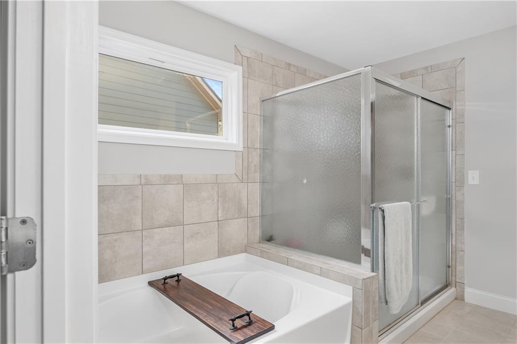 39 Floating Leaf Way Dallas, GA 30132 - Photo 24 of 40 a bathroom with a tub and a shower