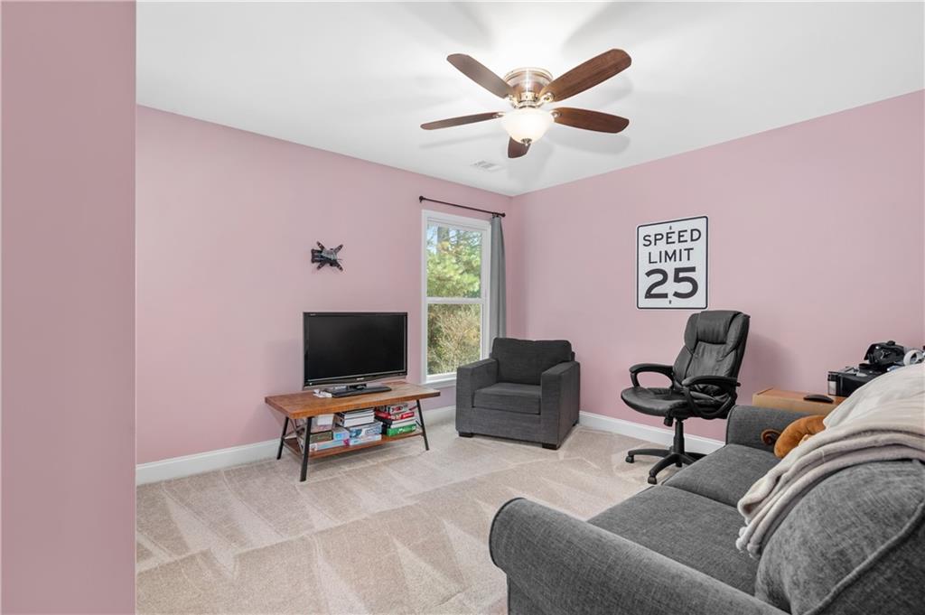 39 Floating Leaf Way Dallas, GA 30132 - Photo 28 of 40 a living room with furniture and a flat screen tv