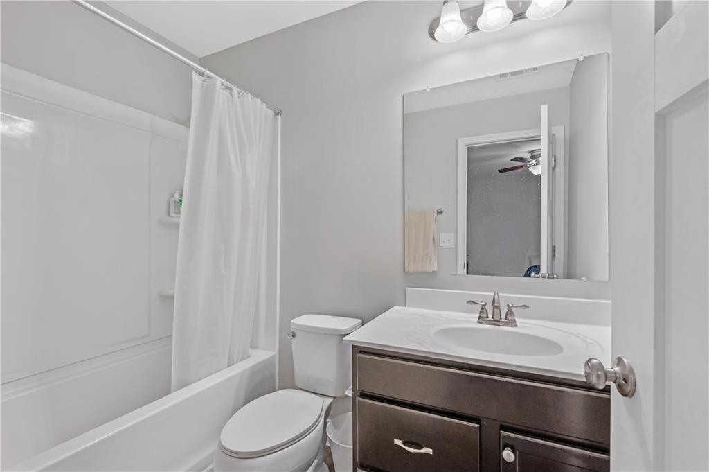 39 Floating Leaf Way Dallas, GA 30132 - Photo 31 of 40 a bathroom with a sink toilet and shower
