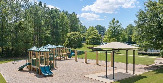39 Floating Leaf Way Dallas, GA 30132 - Photo 40 of 40 a view of a table and chairs under an umbrella