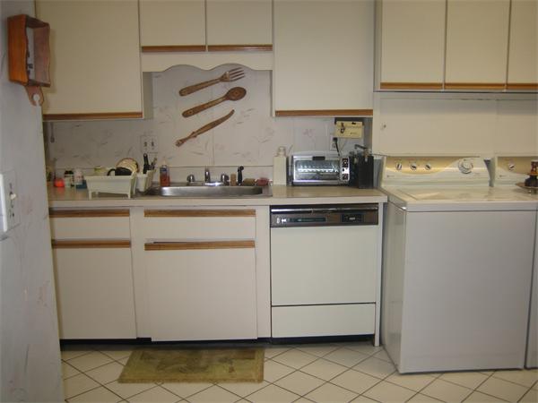 402 Paradise Road, Unit 3L Swampscott, MA 01907 - Photo 3 of 17 a kitchen with white cabinets and sink