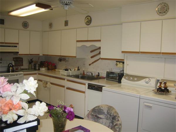 402 Paradise Road, Unit 3L Swampscott, MA 01907 - Photo 4 of 17 a kitchen with stainless steel appliances granite countertop a sink a stove and cabinets