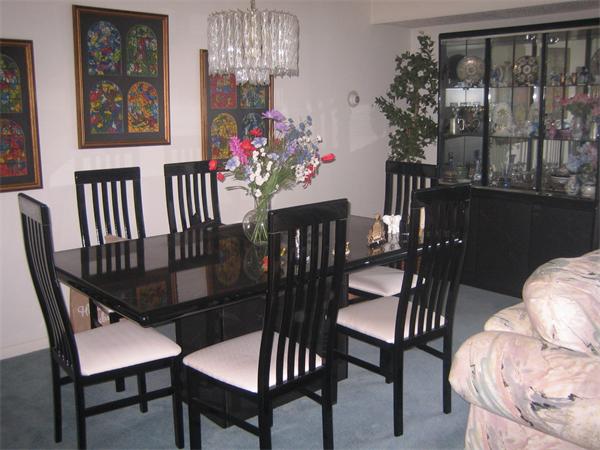 402 Paradise Road, Unit 3L Swampscott, MA 01907 - Photo 8 of 17 a view of a dining room with furniture and chandelier