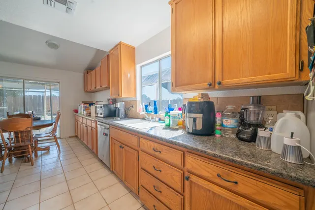 a kitchen with sink and cabinets