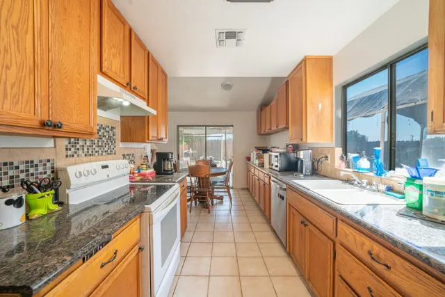 a kitchen with granite countertop lots of counter top space