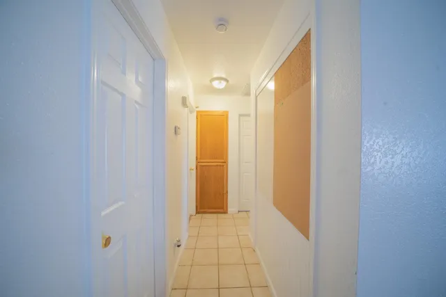 a view of a hallway with a white walls