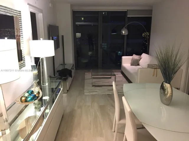 a bathroom with a sink mirror and vanity