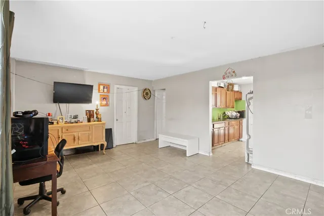 a livingroom with workspace and a couch