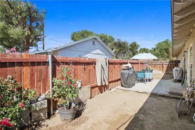 a view of potted plants and floor to ceiling window