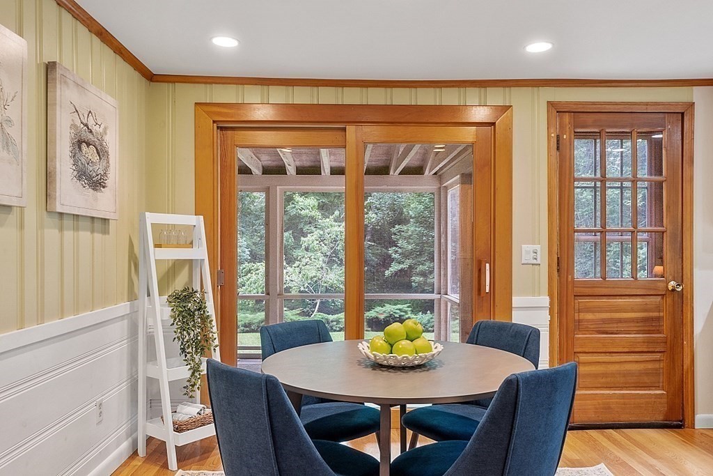 100 Chester Road Boxborough, MA 01719 - Photo 12 of 40 a view of a dining room with furniture a chandelier and wooden floor